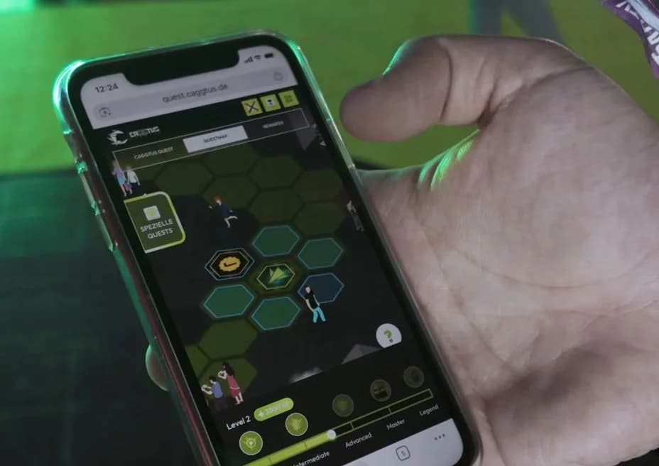 Phone showing the Conquestador quest map in Lisbon